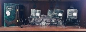 Metal and wood easels for small frames or objects.